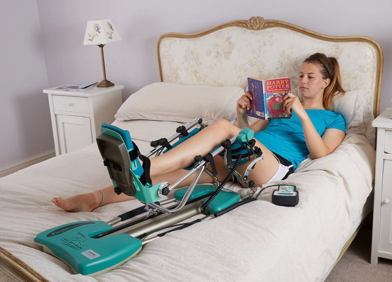 woman on cpm on bed reading lr 6aad28ea eff5 4c5c 90c3 73eedd660695