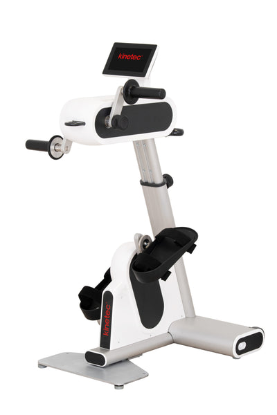 A white and silver Kinoteck indoor exercise bike with black accents, featuring a digital display screen and adjustable seat, isolated on a white background.